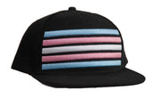 Trans Pride snapback hat with 3D embroidered pink, white, and blue stripes on a black flat-bill cap — Outer Peace Gear